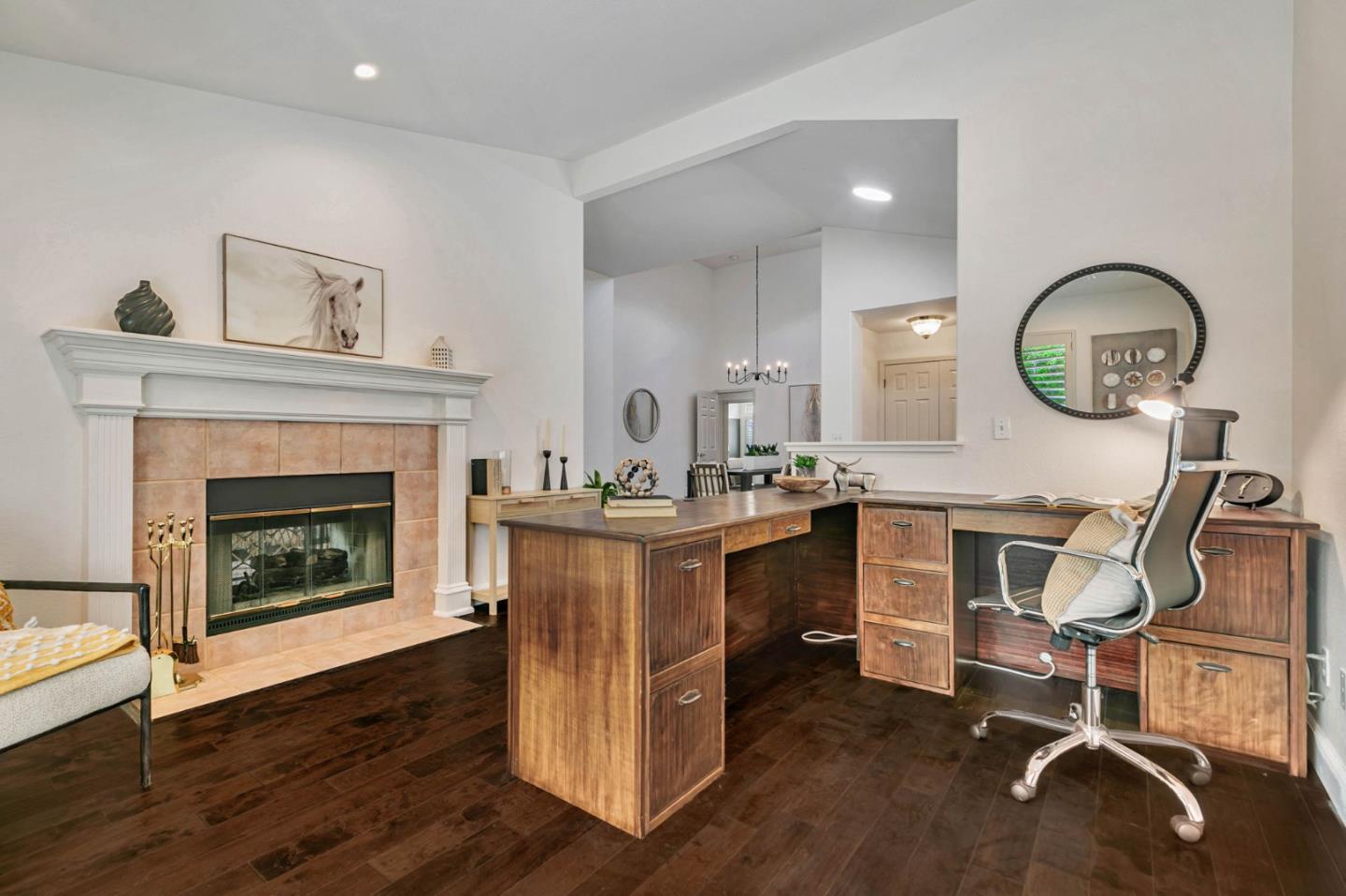 8718 McCarty Ranch Drive San Jose, CA 95135 - Photo 23 of 60 a living room with furniture a fireplace and a mirror