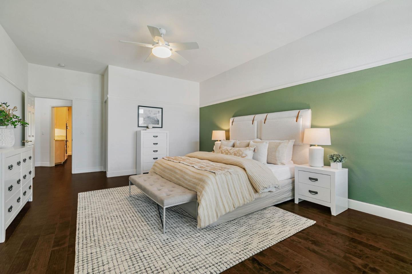 8718 McCarty Ranch Drive San Jose, CA 95135 - Photo 27 of 60 a bedroom with a large bed and a chandelier