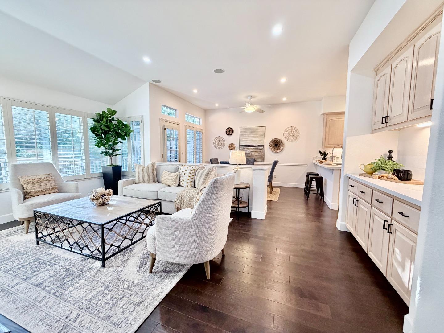8718 McCarty Ranch Drive San Jose, CA 95135 - Photo 5 of 60 a living room with furniture fireplace and a table