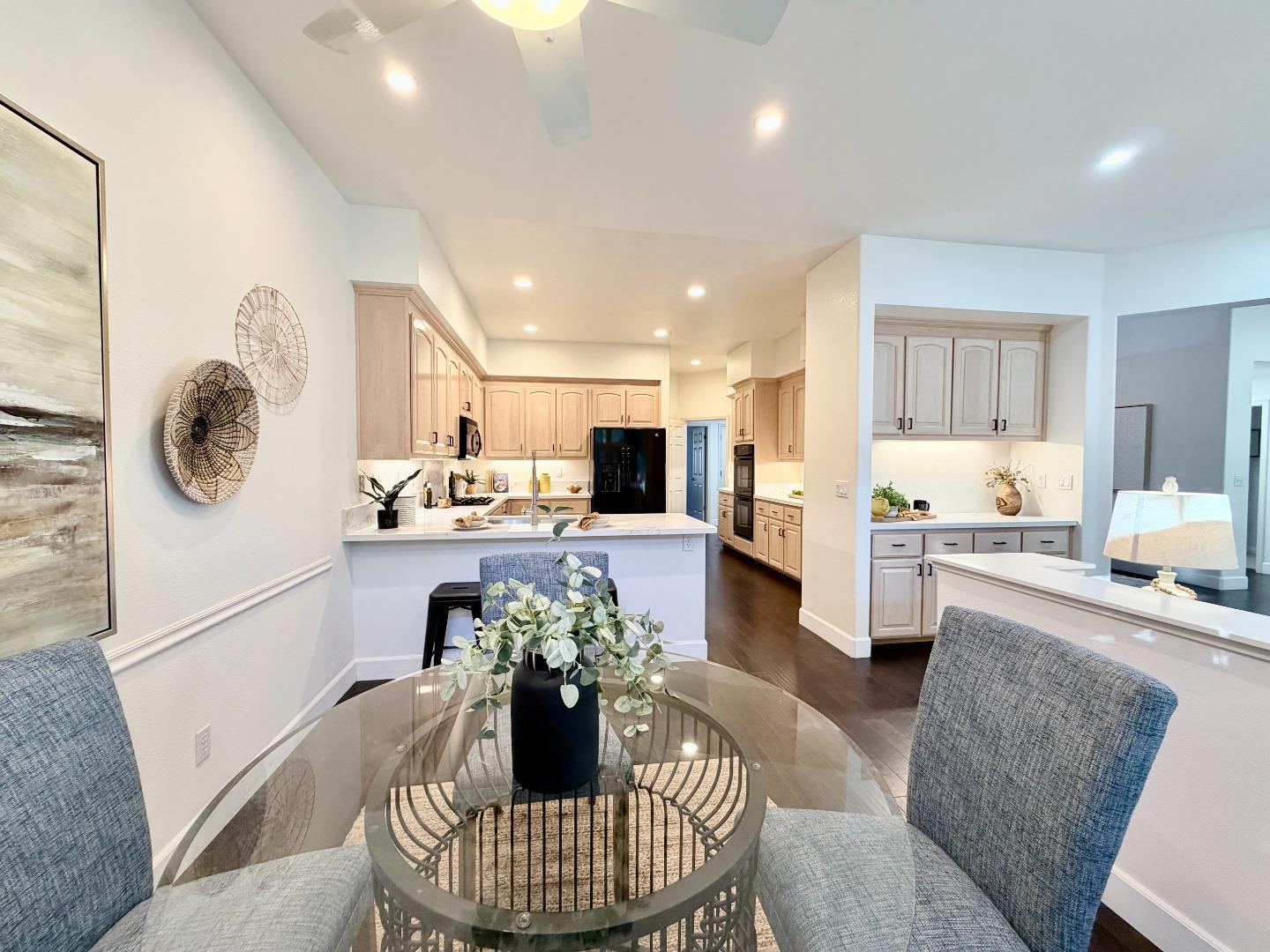 8718 McCarty Ranch Drive San Jose, CA 95135 - Photo 10 of 60 a living room with furniture and kitchen view