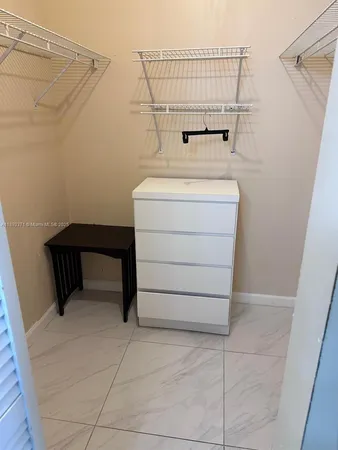 a view of a hallway with a door