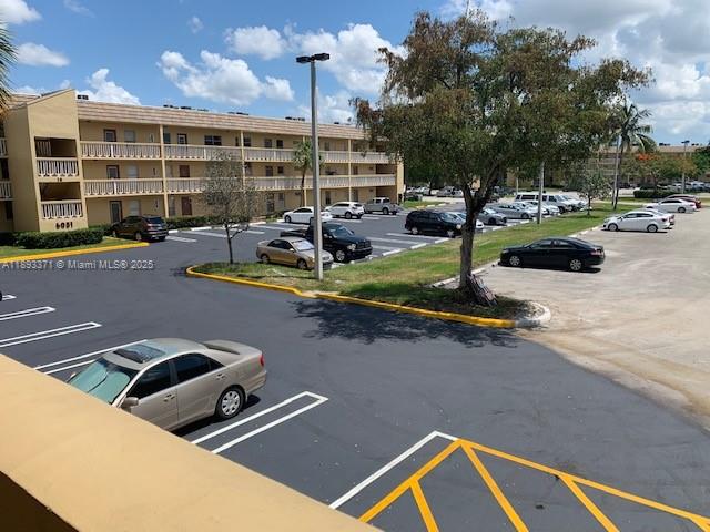 6021 Northwest 61st Avenue, Unit 208 Tamarac, FL 33319 - Photo 16 of 17 a view of a street with chairs