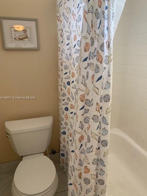 6021 Northwest 61st Avenue, Unit 208 Tamarac, FL 33319 - Photo 8 of 17 a white toilet sitting next to a shower curtain