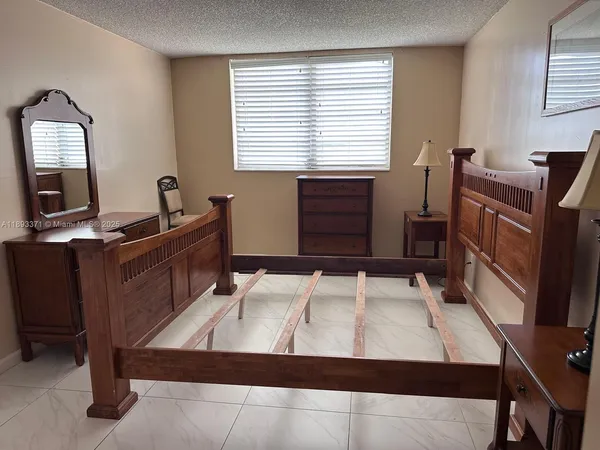 a bedroom with furniture and windows