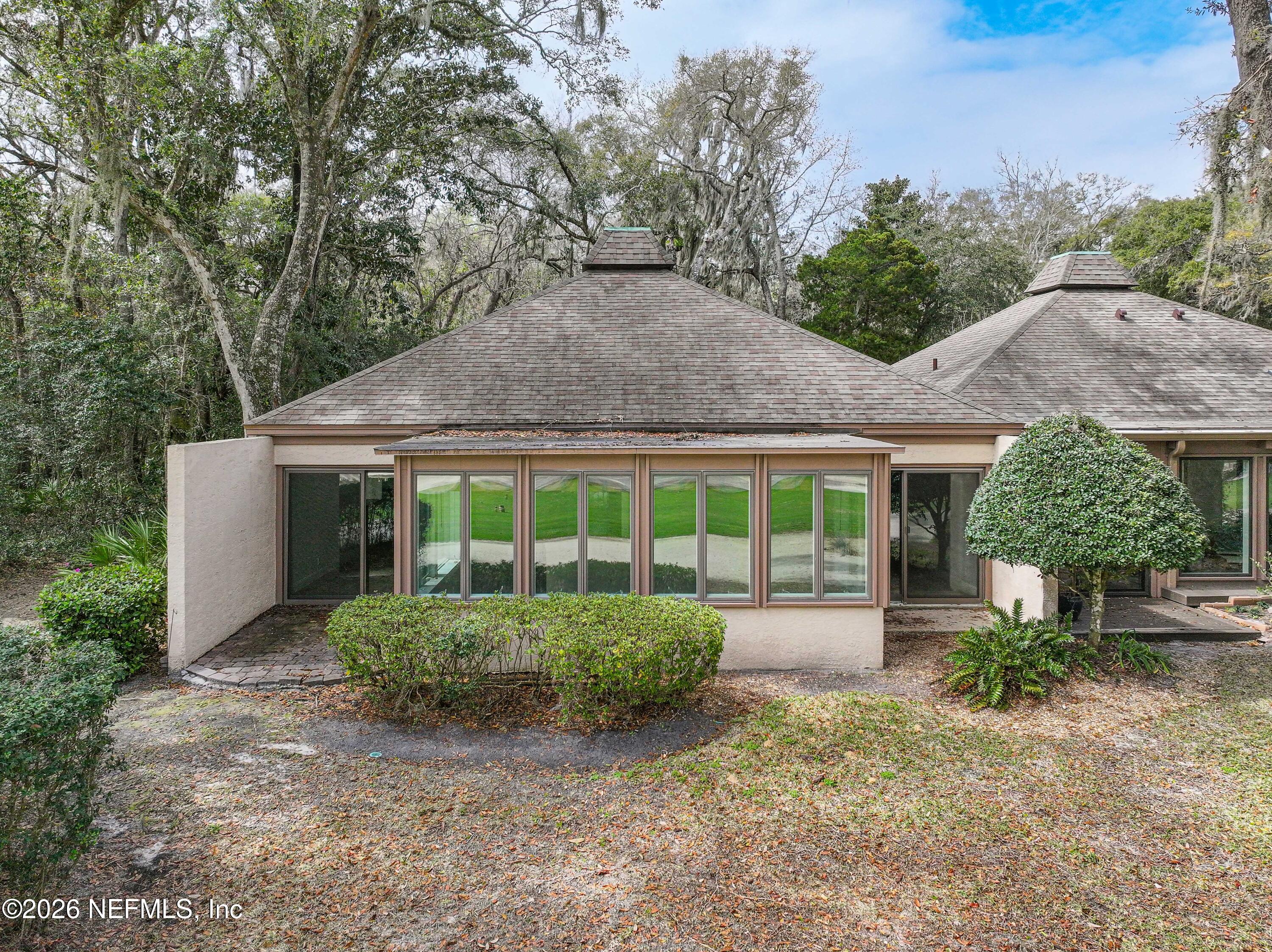 3301 Sea Marsh Road Fernandina Beach, FL 32034 - Photo 30 of 41 a front view of a house with a yard