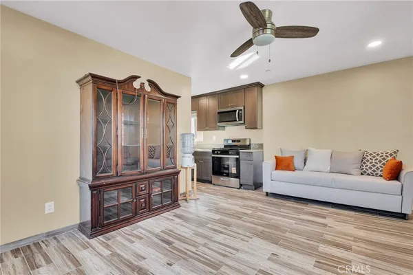 a bedroom with a bed and a ceiling fan