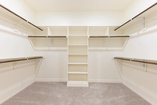 a view of an empty walk in closet