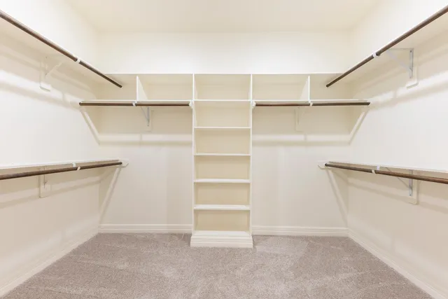a view of an empty walk in closet