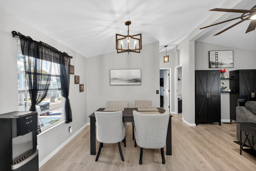 102 Village Circle Sacramento, CA 95838 - Photo 15 of 32 a dining room with furniture a window and wooden floor