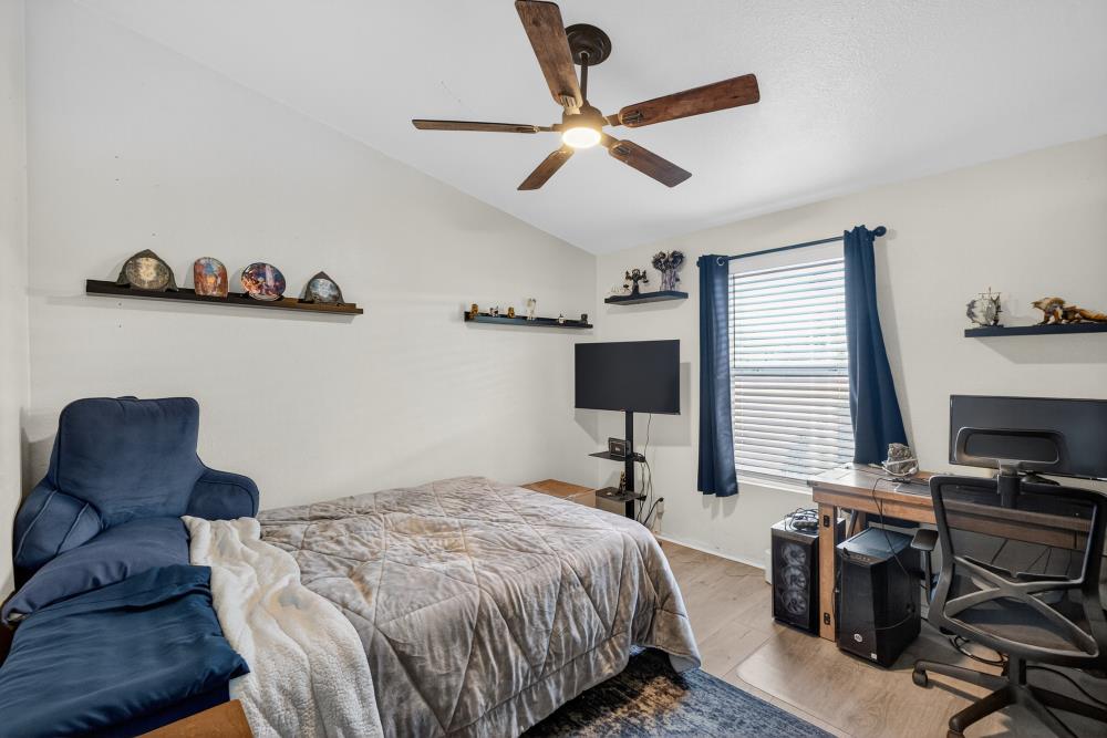 102 Village Circle Sacramento, CA 95838 - Photo 19 of 32 a bedroom with a bed and a chair