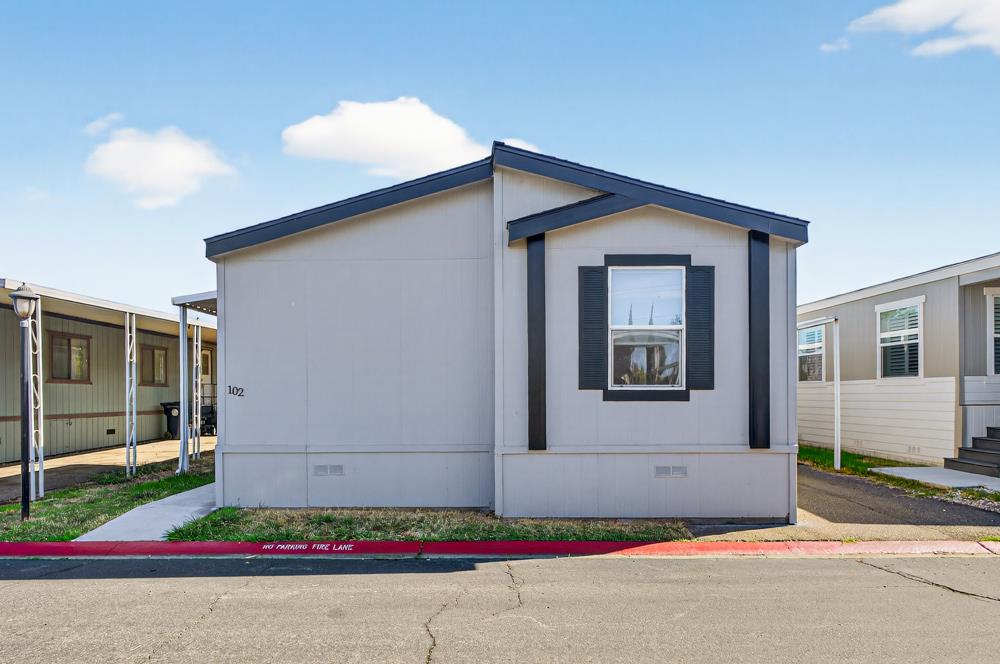 102 Village Circle Sacramento, CA 95838 - Photo 2 of 32 a house with trees in the background