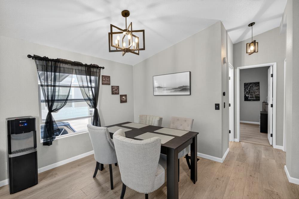 102 Village Circle Sacramento, CA 95838 - Photo 7 of 32 a view of a dining room with furniture and wooden floor