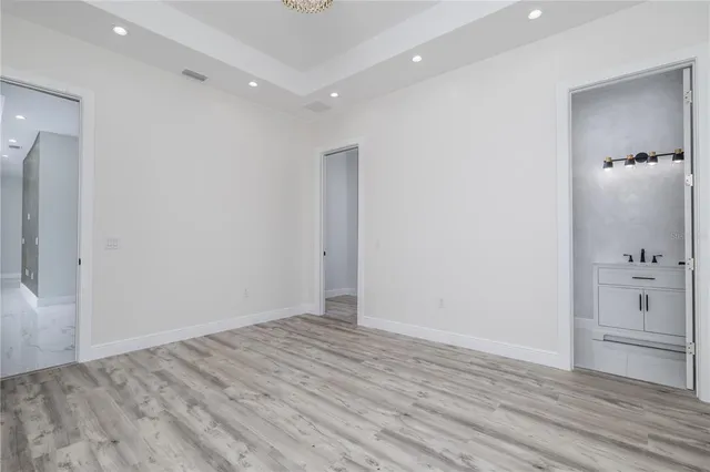 wooden floor in an empty room with a closet
