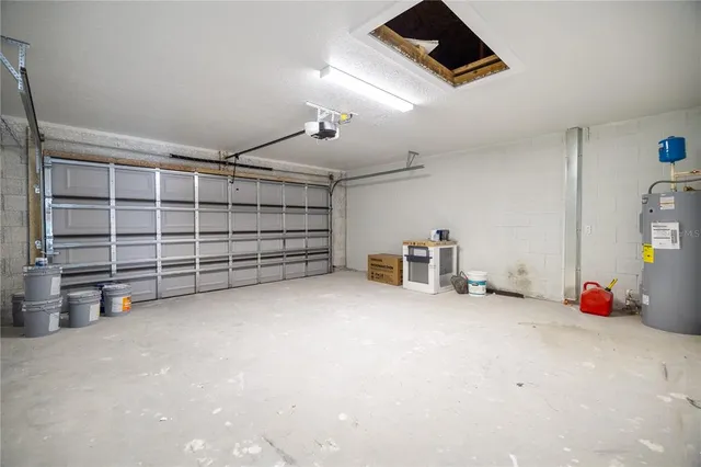 a view of an empty room with furniture and storage