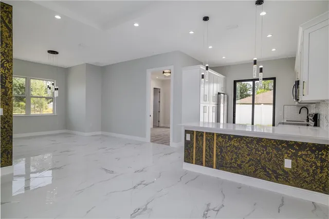 a large bathroom with a large tub and sink