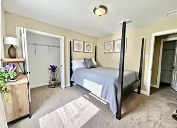 4716 Chanson Crossing Crestview, FL 32539 - Photo 13 of 16 a bedroom with a bed and a view of bathroom