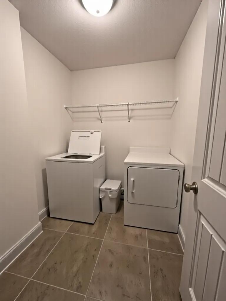 4716 Chanson Crossing Crestview, FL 32539 - Photo 15 of 16 a utility room with dryer and washer