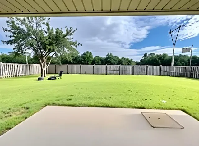 a view of swimming pool with a yard
