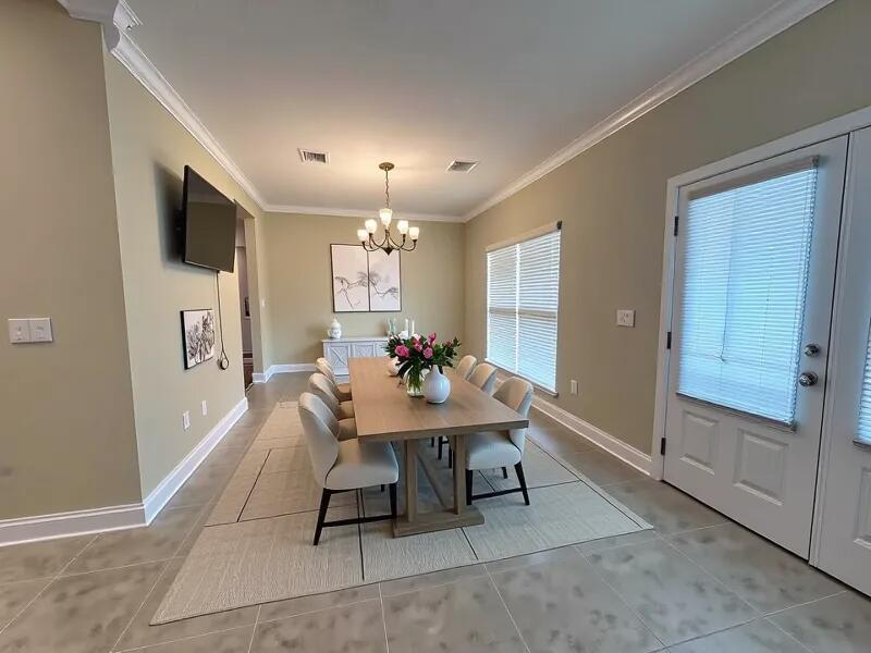 4716 Chanson Crossing Crestview, FL 32539 - Photo 6 of 16 a view of a dining room with furniture