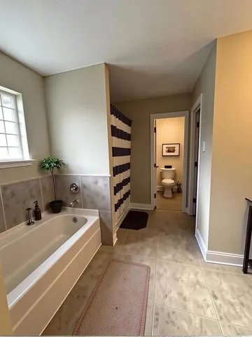 a view of a bedroom with washing machine