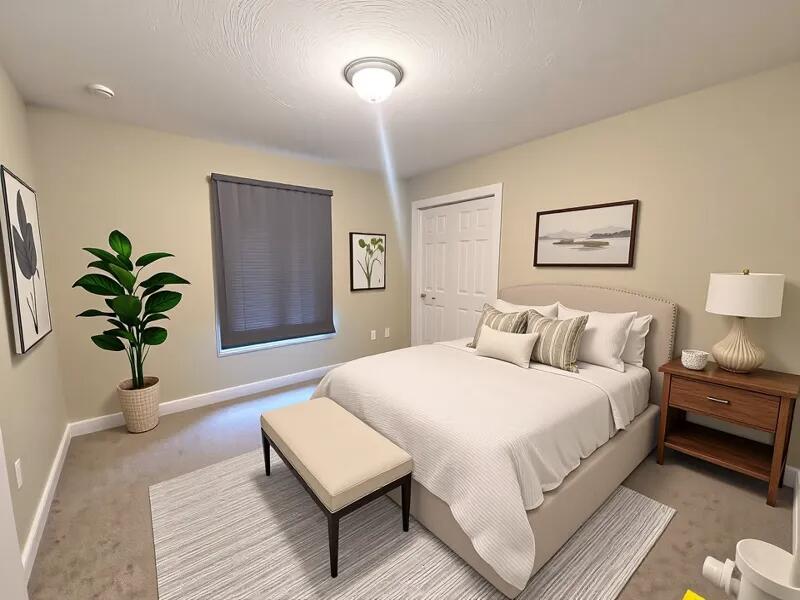 4716 Chanson Crossing Crestview, FL 32539 - Photo 10 of 16 a bedroom with a bed and a potted plant