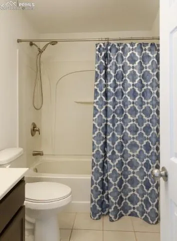 a bathroom with a shower curtain