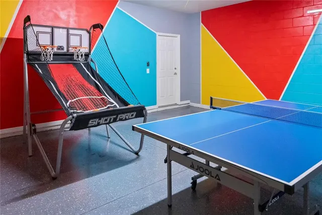 a room with wooden floor and windows