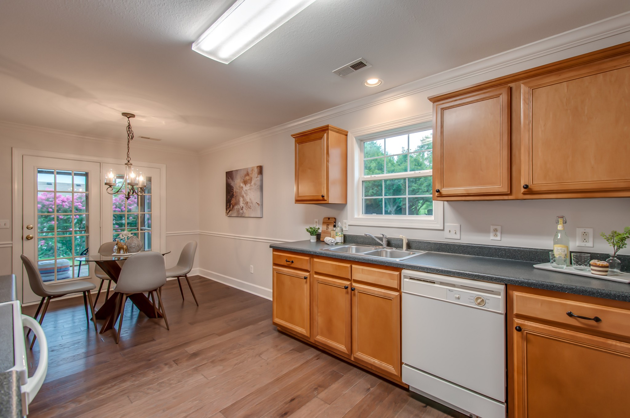 1949 Portway Road Spring Hill, TN 37174 - Photo 11 of 34 a kitchen with a sink a window a dining table and chairs