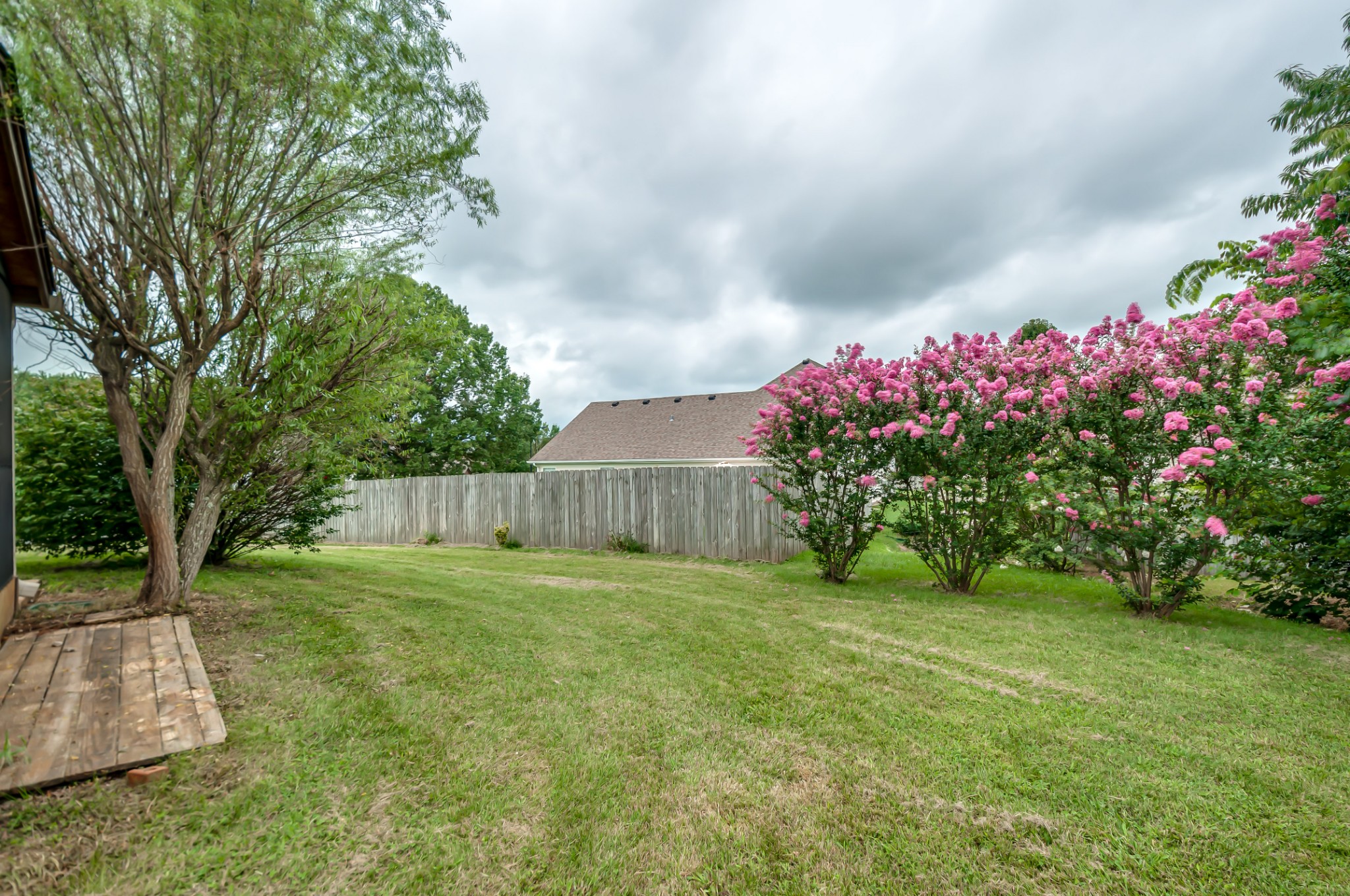 1949 Portway Road Spring Hill, TN 37174 - Photo 33 of 34 a view of a backyard with potted plants and large tree