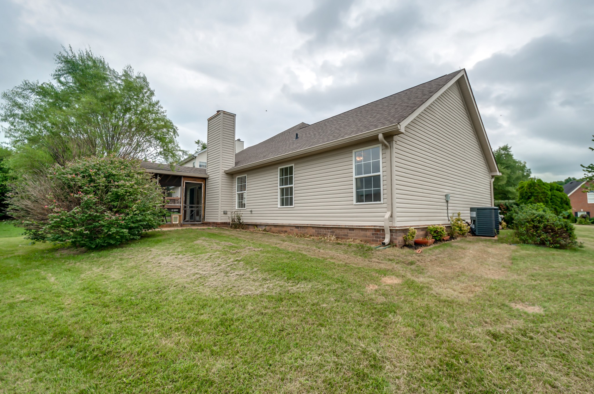 1949 Portway Road Spring Hill, TN 37174 - Photo 34 of 34 a view of a house with a backyard and garage