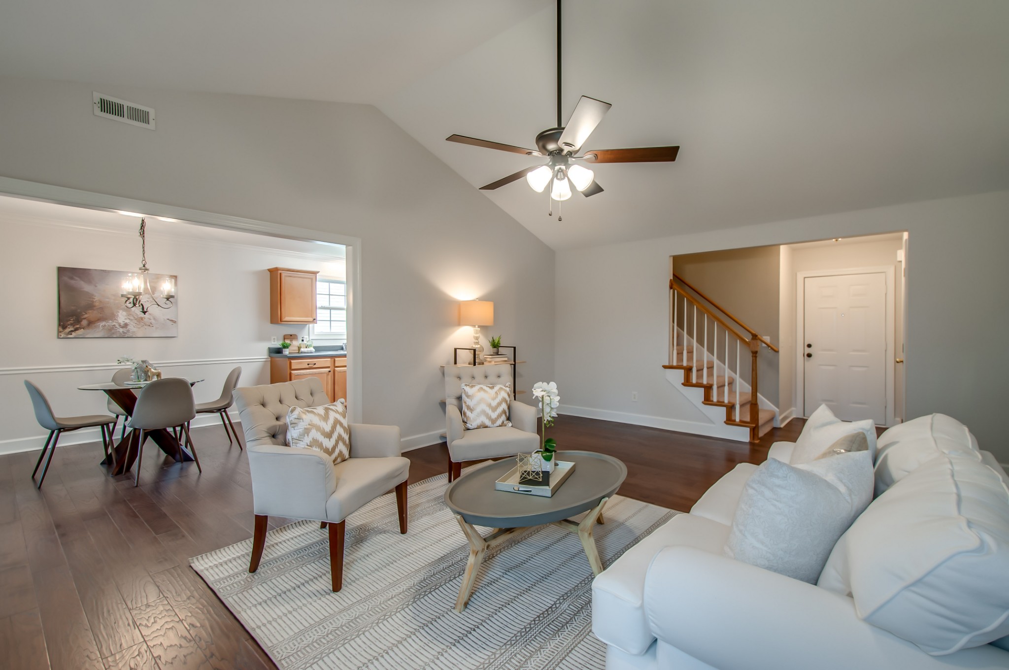 1949 Portway Road Spring Hill, TN 37174 - Photo 6 of 34 a living room with furniture a dining table and a chandelier