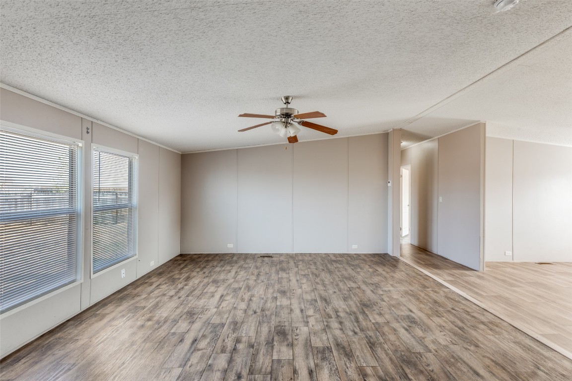 346 Rancho Linda Drive Lockhart, TX 78644 - Photo 6 of 25 wooden floor in an empty room with a window