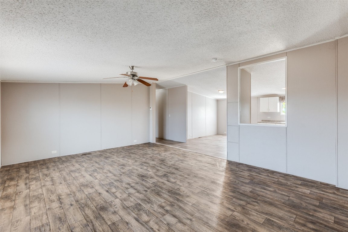 346 Rancho Linda Drive Lockhart, TX 78644 - Photo 7 of 25 a view of a big room with wooden floor and windows