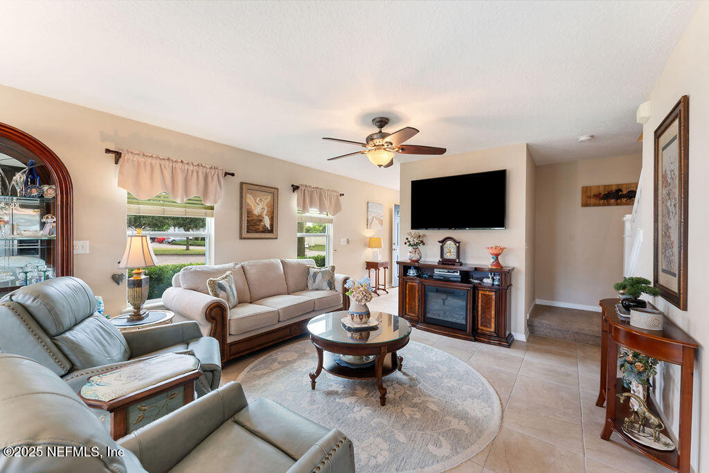 205 Islander Drive St. Augustine, FL 32080 - Photo 15 of 43 a living room with furniture and a flat screen tv