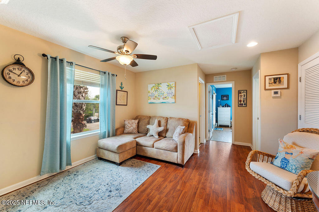 205 Islander Drive St. Augustine, FL 32080 - Photo 16 of 43 a living room with furniture and wooden floor