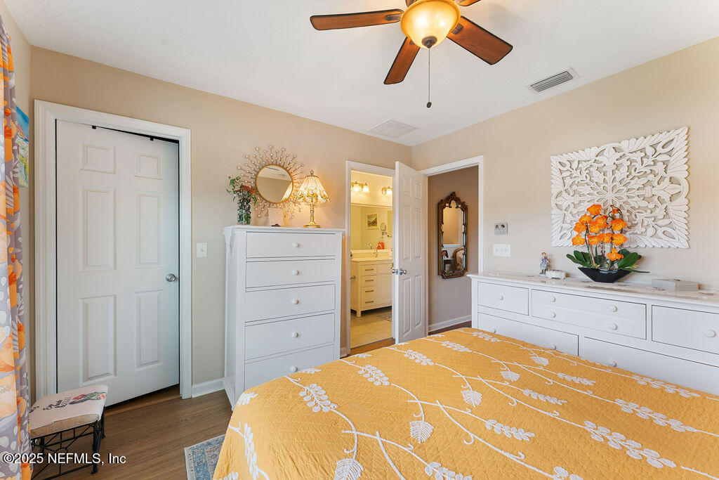 205 Islander Drive St. Augustine, FL 32080 - Photo 20 of 43 a spacious bedroom with a bed and a dresser