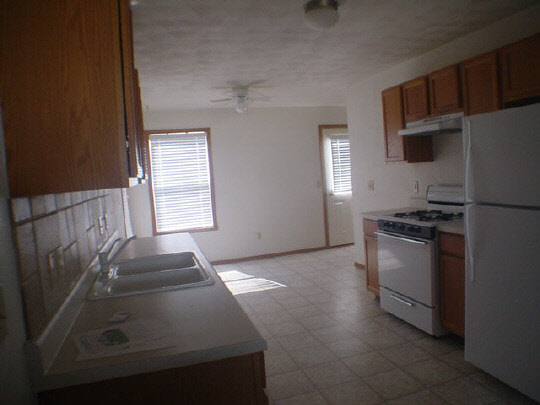 3963 Linden Road Rockford, IL 61109 - Photo 4 of 6 a kitchen with a sink and a stove top oven