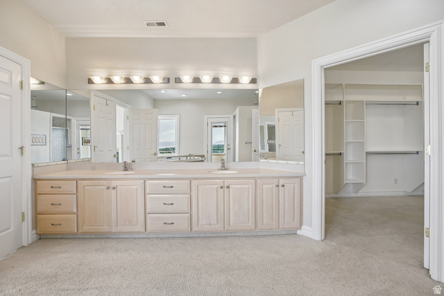 220 East Ridge Road Orem, UT 84057 - Photo 24 of 52 Double vanity with two integrated sinks, extensive countertop space, and under-cabinet storage