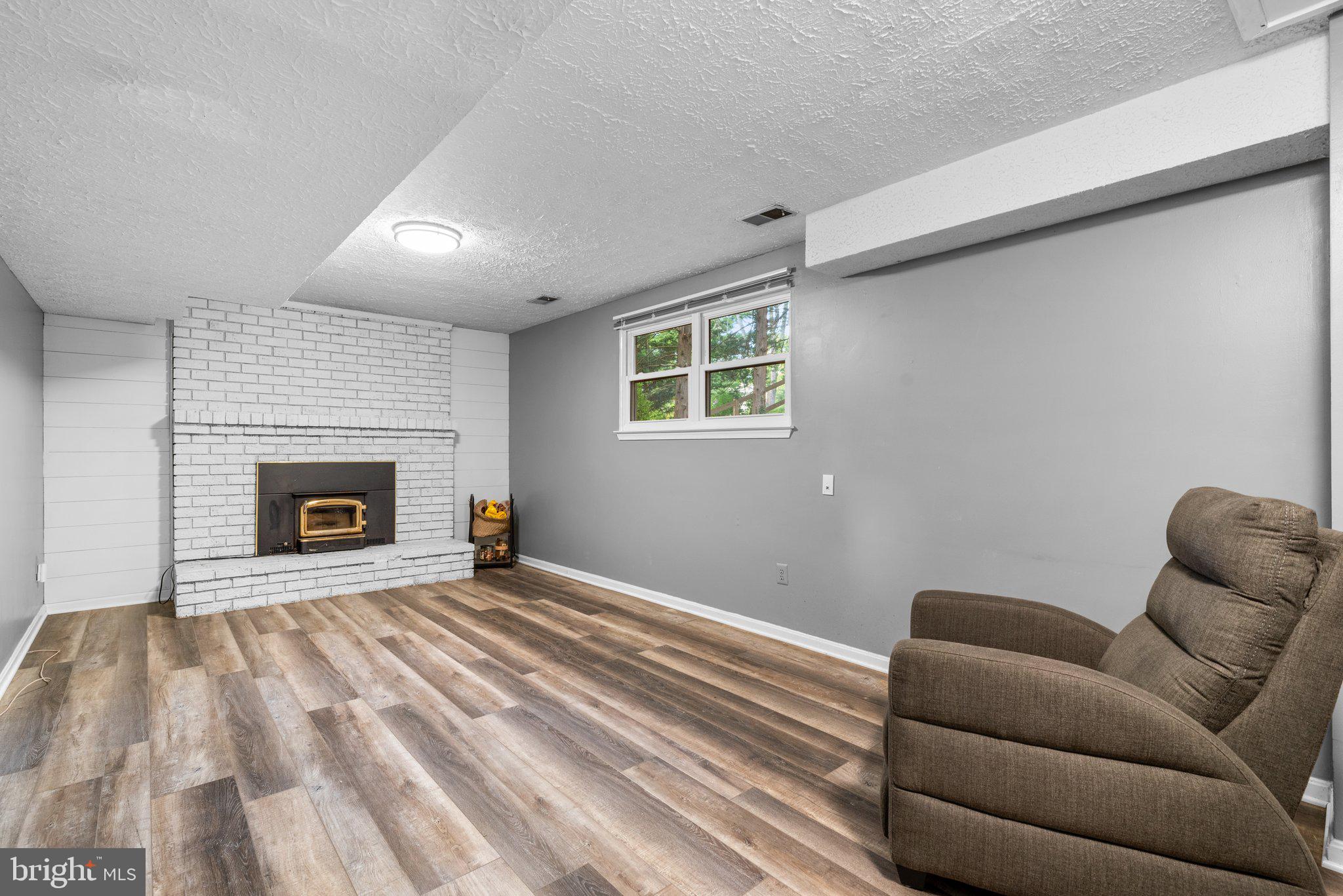 8630 Bali Road Ellicott City, MD 21043 - Photo 20 of 32 Lower Level Rec. Room with Brick Fireplace