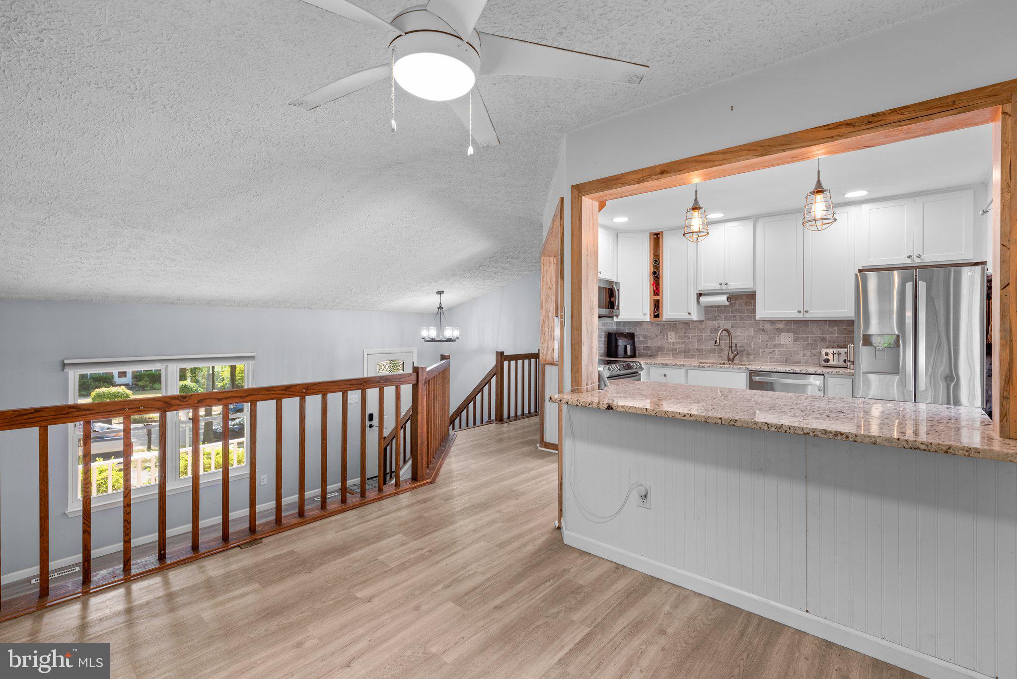 8630 Bali Road Ellicott City, MD 21043 - Photo 6 of 32 Upper Level Dining Room Balcony overlook to LR