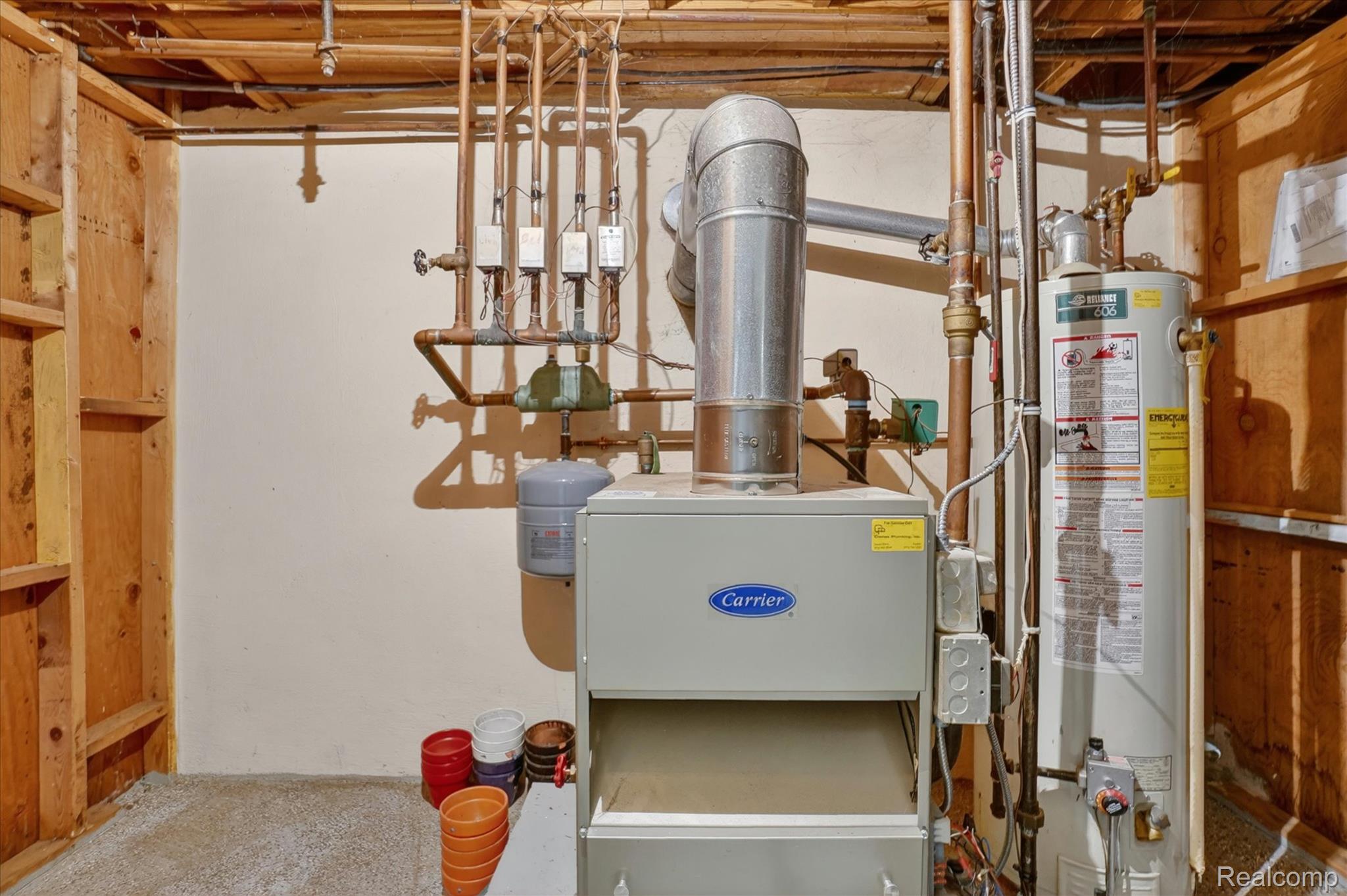 7358 Morrish Road Swartz Creek, MI 48473 - Photo 35 of 39 Utility room featuring gas water heater and a heating unit