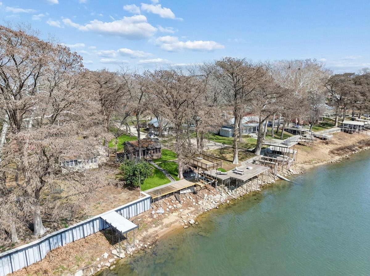 1307 Terminal Loop Road McQueeney, TX 78123 - Photo 21 of 23 a view of residential houses with outdoor space and lake view