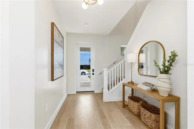 a large kitchen with a table and chairs