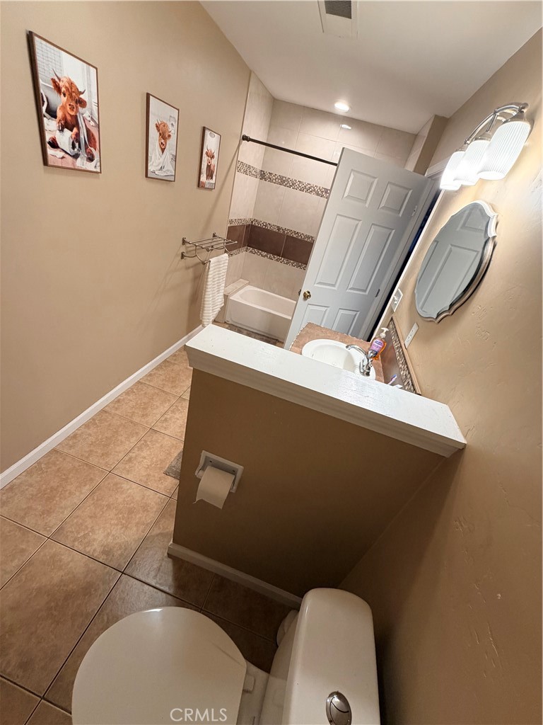 1896 Maryvale Lane Hemet, CA 92544 - Photo 16 of 33 a bathroom with a toilet and a mirror