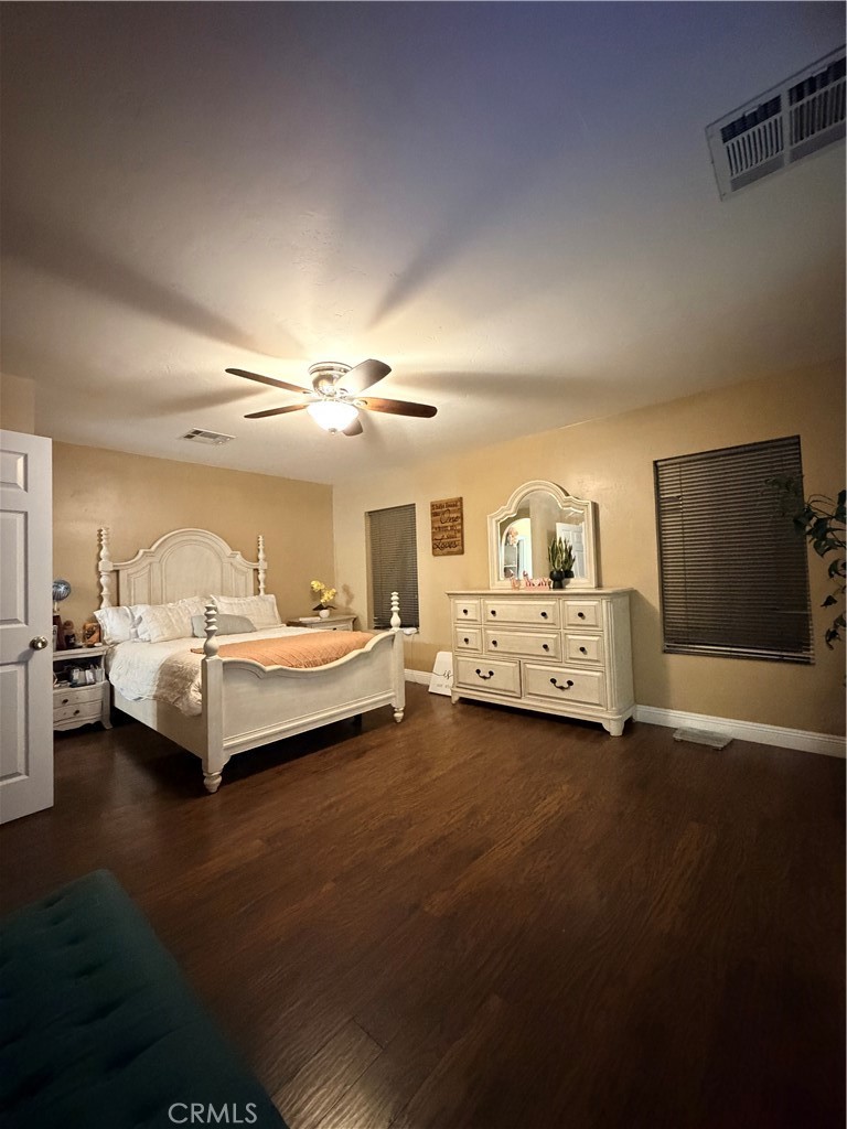 1896 Maryvale Lane Hemet, CA 92544 - Photo 17 of 33 a spacious bedroom with a bed and a couch