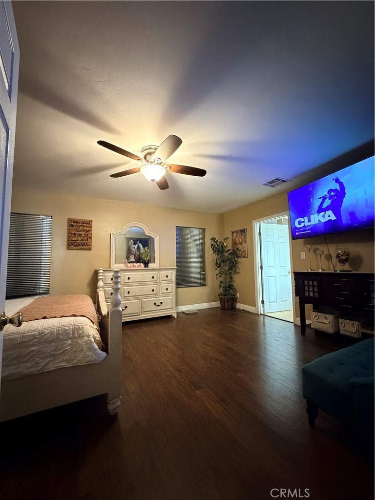 1896 Maryvale Lane Hemet, CA 92544 - Photo 18 of 33 a bedroom with furniture and a fireplace
