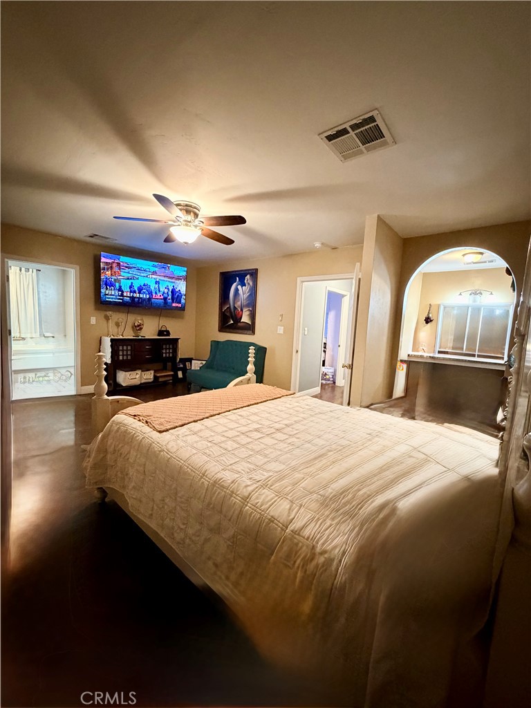 1896 Maryvale Lane Hemet, CA 92544 - Photo 19 of 33 a bedroom with a bed and a large mirror