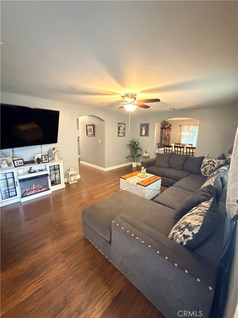 1896 Maryvale Lane Hemet, CA 92544 - Photo 2 of 33 a living room with furniture and a flat screen tv