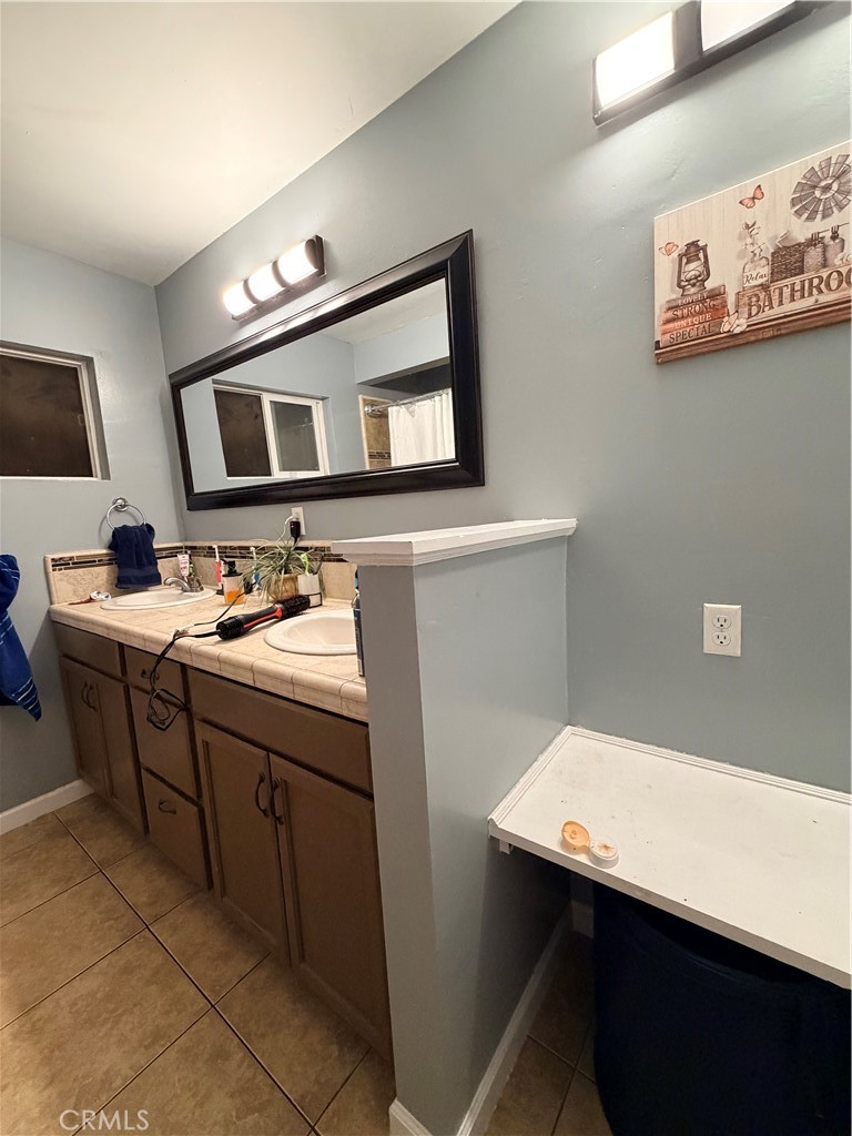 1896 Maryvale Lane Hemet, CA 92544 - Photo 28 of 33 a kitchen with a sink cabinets and wooden floor
