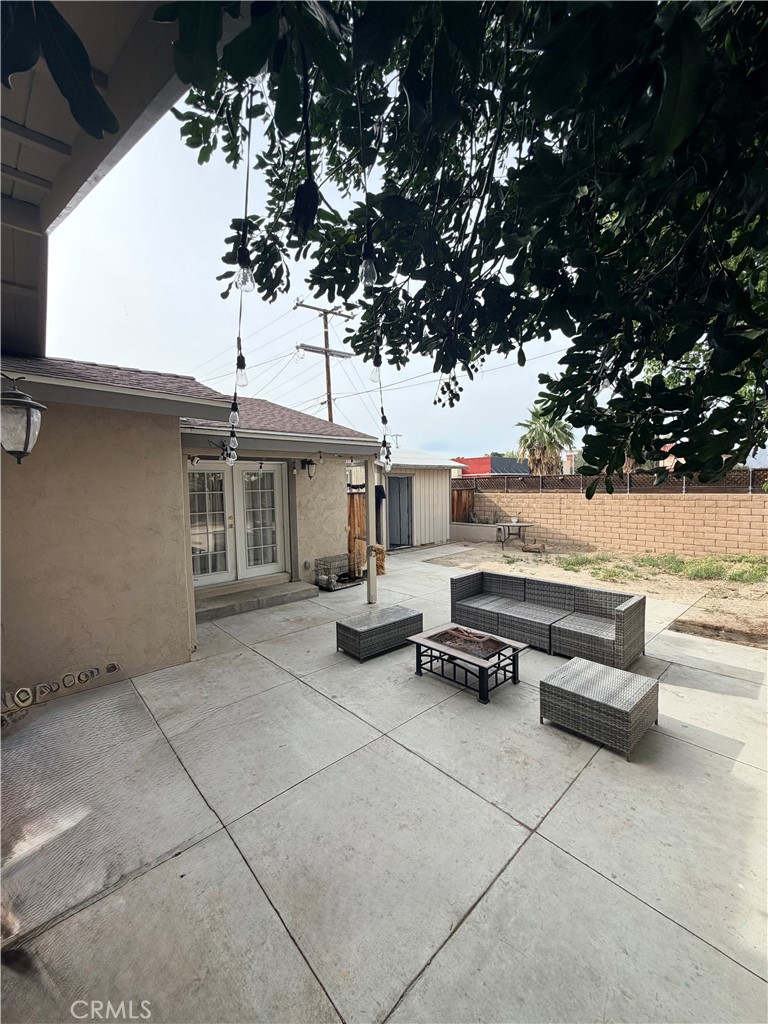 1896 Maryvale Lane Hemet, CA 92544 - Photo 31 of 33 a backyard of a house with barbeque oven and outdoor seating